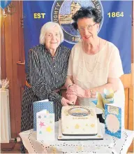  ??  ?? Margaret Fairweathe­r and Linda Robertson are the longest-serving lady members at Broughty Castle Bowling Club. The pair, who joined in 1969, are pictured cutting the cake at the club’s recent Ladies Section’s 60th anniversar­y party.