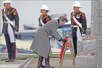  ?? Photograph: Kevin McGlynn ?? Princess Anne lays a wreath at the war memorial in Port Ellen to commemorat­e the sinkings.