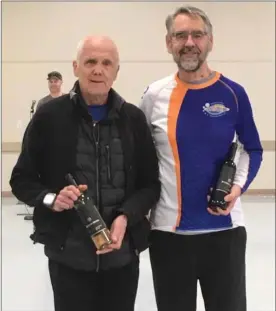  ?? Special to The Daily Courier ?? Kelowna Running Club members Peter Pollhammer, left, and Garry Bell placed first and third, respective­ly, in the M74-79 age class at the recent Oliver 10K.