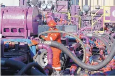  ?? BRENNAN LINSLEY/ASSOCIATED PRESS ?? A worker adjusts hoses at a gas well near Mead, Colo. The Environmen­tal Protection Agency on Wednesday held its only public hearing on the Trump administra­tions plans to roll back Obama-era rules for methane.