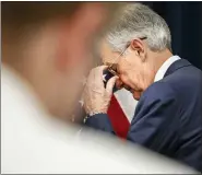  ?? AP PHOTO/JACQUELYN MARTIN ?? Federal Reserve Chair Jerome Powell walks pasts a reporter a the end of news conference Tuesday where he discussed an announceme­nt from the Federal Open Market Committee, in Washington.