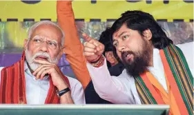  ?? ?? BJP candidate Nisith Pramanik with Prime Minister Narendra Modi during an election campaign rally in Cooch Behar district (file photo)