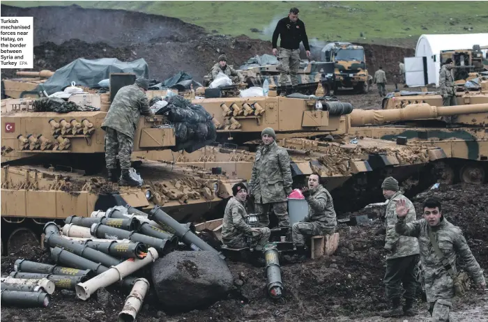  ?? EPA ?? Turkish mechanised forces near Hatay, on the border between Syria and Turkey