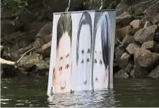  ?? — aP ?? On the surface: a banner floated by the activists with images of (from left) Jong-un, his late father Kim Il-sung and his sister Kim yo-jong.