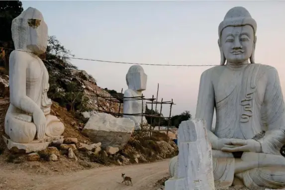  ?? (Reuters) ?? Marble statues of Buddha carved and ready for transport to Mandalay