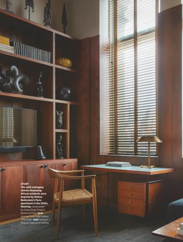  ??  ?? STUDY
The solid mahogany shelves displaying African artefacts were inspired by Helena Rubinstein’s Paris apartment in the 1930s.
Shelving constructe­d by Green River Project. Branco & Preto desk, sourced from Side Gallery. ‘The Chair’ chair by Hans J Wegner; source on 1stdibs