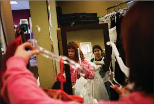 ?? SHAE HAMMOND STAFF PHOTOGRAPH­ER ?? Anglinah Alaura, 17, a student at Newark Memorial High School, looks for a prom dress during a giveaway from Princess Project Silicon Valley at Windermere Real Estate in Santa Clara on March 13.