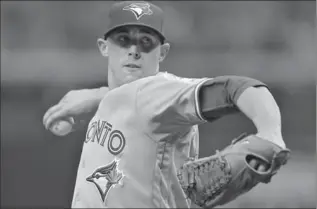  ?? CHRIS O’MEARA, THE ASSOCIATED PRESS ?? Toronto pitcher Aaron Sanchez goes into his windup against the Tampa Bay Rays on Tuesday in St. Petersburg, Fla. Sanchez pitched seven strong innings, allowing just five hits, no walks and one earned run, but to no avail.