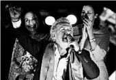  ?? JUAN RUIZ/GETTY-AFP ?? Lenin Moreno talks to supporters Sunday as they celebrate initial results of Ecuador’s runoff election.