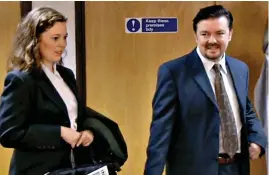  ??  ?? 2002, THE OFFICE: Olivia played Helena, a journalist who is drawn into an excruciati­ng interview with manager David Brent (Ricky Gervais, above) in the cult TV comedy.