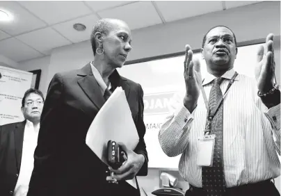  ?? RICARDO MAKYN/CHIEF PHOTO EDITOR ?? Minister of Science, Energy and Technology Fayval Williams listens keenly to general manager of Petrojam, Winston Watson, at a press conference held at the oil refinery’s boardroom on Monday. In the background is Paul Hoo, chairman of the Petrojam board.