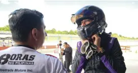  ??  ?? Car Porn Racing’s Angie King talks to co-driver Carlos Anton during one of the driver changes over the eight-hour endurance race