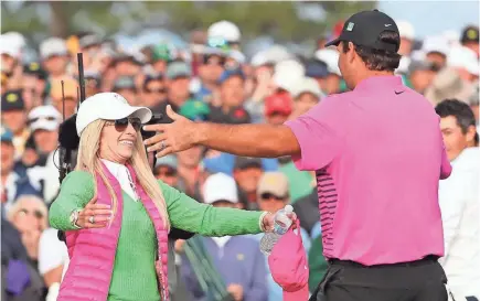  ?? ROB SCHUMACHER/USA TODAY SPORTS ?? Patrick Reed celebrates with his wife Justine after winning the Masters. Justine had her husband’s family escorted off the course during a major tournament one year.