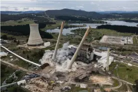  ?? Photograph: Brook Mitchell/Getty Images ?? Explosives set off on Tuesday morning brought down Wallerawan­g power station’s chimney stacks.