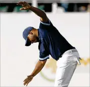  ?? MICHAEL REAVES / GETTY IMAGES ?? Harold Varner III reacts after making his putt attempt on the loudest hole in golf.