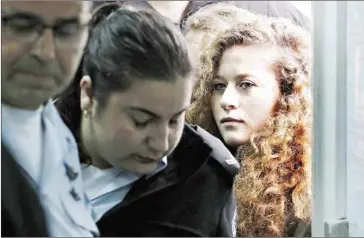  ?? THOMAS COEX/AFP ?? Ahed Tamimi (right), a campaigner against Israel’s occupation, arrives for the beginning of her trial in the Israeli military court at Ofer military prison in the West Bank village of Betunia on February 13.