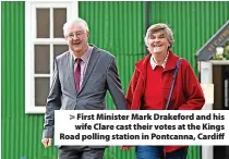  ?? ?? > First Minister Mark Drakeford and his wife Clare cast their votes at the Kings Road polling station in Pontcanna, Cardiff