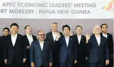 ?? THE ASSOCIATED PRESS ?? Chinese President Xi Jinping, foreground far left, and U.S. Vice-President Mike Pence, foreground far right, stand with other APEC leaders in Port Moresby, Papua New Guinea, on Sunday. As China and the U.S. manoeuvre for influence across the region, the biggest worry is that the jousting could escalate into a full-blown confrontat­ion.
