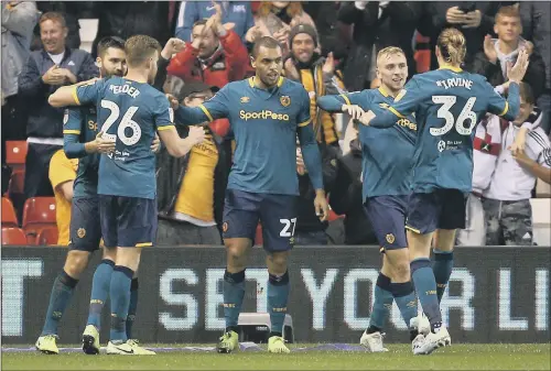  ?? PICTURE: NIGEL FRENCH/PA. ?? STRIKE ONE: Hull City’s Josh Magennis (centre) celebrates scoring his side’s first goal of the game against Nottingham Forest at the City Ground.