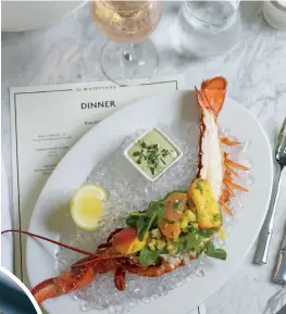  ??  ?? inset: Maidstone Collins. clockwise from upper left: Bright colors pop in The Maidstone’s rooms; half lobster with tarragon remoulade and peach corn salad; seared Montauk fluke with avocado, summer corn, white gazpacho, and hazelnuts.