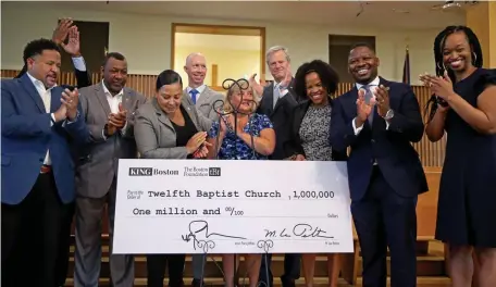  ?? MATT STONE / HERALD STAFF ?? ‘WINDOWS ARE OPEN’: Gov. Baker joins key city community members to celebrate the $1 million donation to Twelfth Baptist Church.