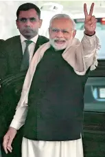  ?? — PTI ?? Prime Minister Narendra Modi flashes victory sign in New Delhi on Monday.