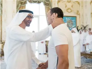  ?? Wam ?? His Highness Sheikh Mohamed bin Zayed Al Nahyan, Crown Prince of Abu Dhabi and Deputy Supreme Commander of the UAE Armed Forces, receives Faisal Al Ketbi who recently won a gold medal in jiujitsu at the World Games in Poland. —