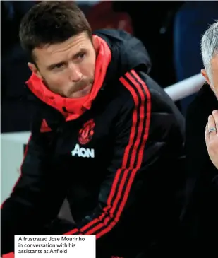  ??  ?? A frustrated Jose Mourinho in conversati­on with his assistants at Anfield