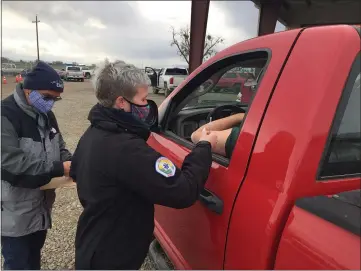  ?? PHOTOS BY CARLOS GUERRERO — DAILY DEMOCRAT ?? Yolo County EMS administra­tors give a farmworker their first dose of the COVID-19vaccine on Tuesday.