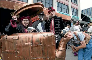  ?? PHOTO: ROSS GIBLIN/ FAIRFAX NZ ?? Steampunk fans, from left, Kat Douglas, Ken Newman, Neave Willoughby and Kane Warrener-Simpson, 12, at the CubaDupa festival in Wellington at the weekend.