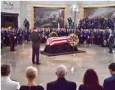  ?? KEVIN DIETSCH/POOL/VIA AP ?? The flag-draped casket of Sen. John McCain lies in state Friday at the U.S. Capitol.