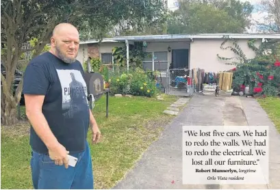  ?? MARTIN E. COMAS/SENTINEL STAFF ?? Robert Munnerlyn stands outside his family’s home in the Orlo Vista neighborho­od. The home and yard were flooded during Hurricane Irma.