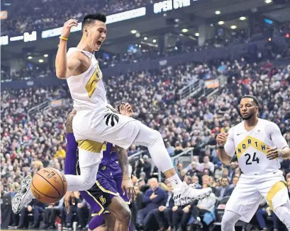  ?? FRANK GUNN THE CANADIAN PRESS ?? Jeremy Lin, left, and Norm Powell are still trying to prove their playoff worthiness to Raptors head coach Nick Nurse.