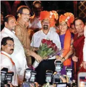  ?? PIC/PTI ?? Vishwanath Mahadeshwa­r, who will be Mumbai’s 76th mayor, with Shiv Sena president Uddhav Thackeray outside the BMC headquarte­r in Mumbai on Wednesday