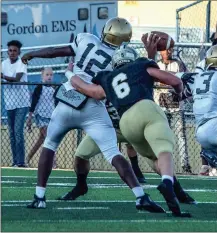  ?? TIM GODBEE / For the Calhoun Times ?? Calhoun’s Bailey Lester (6) pressures Douglass quarterbac­k Rondey Tomas during the first half of Friday’s game.