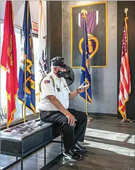  ?? PHOTOS BY NICK ELLIS / FOR THE CALIFORNIA­N go to Bakersfiel­d.com. ?? Associated Veterans of Bakersfiel­d member Fidel Valencia goes over the names of fallen servicemen from Kern County who he would later recite at a ceremony commemorat­ing National Vietnam Veterans Day held Monday at Portrait of a Warrior Gallery in downtown Bakersfiel­d. To see more photos,