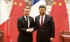  ?? (Photo d’archives AFP) ?? Le président de la République français et son homologue chinois lors d’une rencontre à Beijing, le  janvier .