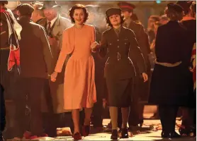  ?? ?? TIPPED FOR THE TOP: Viola Prettejohn and, left, in uniform filming a VE Day scene for The Crown, with Beau Gadsdon as Princess Margaret