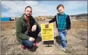  ?? Associated Press ?? Chad Zolman, left, with his 5-year-old son, Quinten, on Wednesday at the site of their yet-to-be-constructe­d home in Castle Rock, Colo. “The rates kept going up, and the more the rates kept going up, the less house you can buy,” said Zolman, 41. “And the less house you can buy in this market, that’s not good. You have to be able to pony up the cash.”