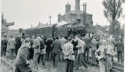  ??  ?? Pictured is unusual activity at Shepshed railway station as members of the Leicester Railway Society have a look around the station premises. Photo sent in by Looking Back reader Jim Matthews.