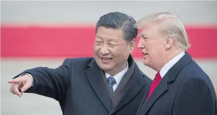  ??  ?? China’s President Xi Jinping, left, welcomes US President Donald Trump to the Great Hall of the People in Beijing in this November 2017 photo.