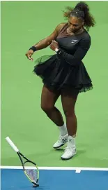  ??  ?? Smash: Serena destroys her racket in her outburst at the U.S. Open final