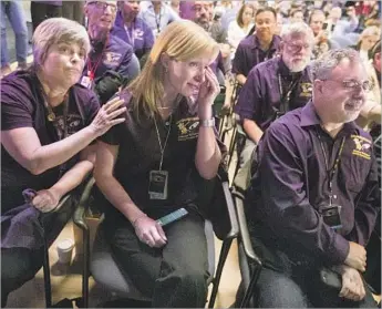  ?? Brian van der Brug Los Angeles Times ?? CASSINI TEAM members Jo Pitesky, left, Nora Alonge and Scott Eddington watch with emotion in the Jet Propulsion Laboratory auditorium as the spacecraft burns up in Saturn’s atmosphere on Sept. 15.