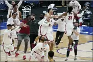  ?? MARK HUMPHREY — THE ASSOCIATED PRESS ?? Alabama players celebrate after beating LSU in the championsh­ip game at the NCAA college basketball Southeaste­rn Conference Tournament Sunday, March 14, 2021, in Nashville, Tenn.