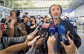  ??  ?? Speaking freely: Ma speaking to reporters after arriving at the Hong Kong internatio­nal airport. — AP