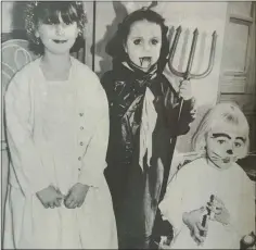  ?? ?? FAIRIES Michaela Jones and Rebecca Allister with ‘The Devil’ Ethna Houston at Enniskille­n Castle’s ‘Ghostly Goings On’. 1996.
