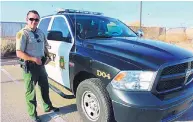  ?? STEPHEN MONTOYA/RIO RANCHO OBSERVER ?? Sandoval County Sheriff’s deputy Jacob Trujillo is shown with his patrol unit just before his shift begins.