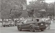  ?? File ?? In this October 2019 photo, a camera car for “Blue Bayou,” the working title of the new Black Widow movie, waits at Chuck’s Corner for traffic to clear on South Broad Street to film a scene. The movie is set to debut July 9 in theaters and on Disney+ with premier access.