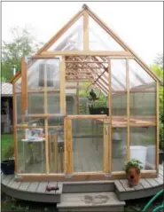  ?? PHOTOS BY DEAN FOSDICK VIA AP ?? At right, a Hobby Greenhouse is shown in a Langley, Wash., backyard. This greenhouse was built on a platform to prevent troublesom­e weed growth. Weed management in greenhouse­s, hoop houses and other enclosed settings includes prevention, sanitation,...