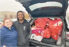  ?? LORRAINE MIRABELLA/BALTIMORE SUN ?? Christine Gower and Cortrell Armwood bought toys at Target in White Marsh, taking advantage of a Black Friday buy one, get one half off promotion. Gower said the gifts are for kids in her family and for a Secret Santa exchange for an adopted family.